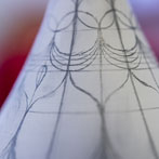 Rhian Malin decorating a mandala bottle in her workshop 2019